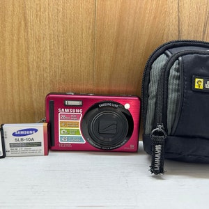 Samsung SL720 Digital Camera Compact 12 MP 5X Optical Zoom Smart Auto  + 4GB Memory Card, battery, case and handstrap