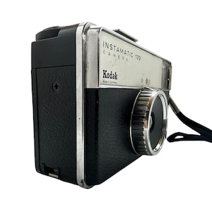 5 vintage cameras including a Kodak Instamatic 133-X German made film camera in original case, Olymp