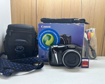 Canon PowerShot SX130 HD Digital Camera 12X Optical Zoom 12.1 MP Compact + Box, Case, Strap, 4GB memory card and Cable