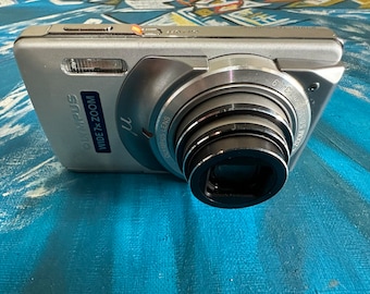 Olympus Stylus M 7010 Digital Camera 12 MP 7X Dual Optical Zoom Hyper Crystal 2.7 LCD Compact Image Stabilization