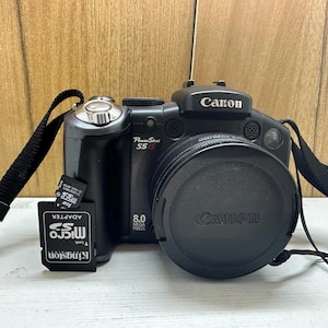 Cámara digital Canon PowerShot Pro Series S5IS, 8 MP, zoom óptico de 12 aumentos, baterías AA de 1,5 V, tarjeta de memoria de 1 Gb, correa para el cuello