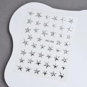 Pegatinas de uñas de estrellas plateadas y negras con diamantes de imitación, calcomanías celestiales Y2K, arte de uñas de explosión estelar 3D, decoración de manicura DIY, 1 hoja