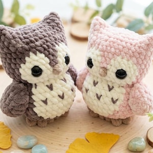 May include: A white ceramic mug with a black handle and the text "But First, Coffee" in a black, handwritten-style font. The mug is on a white surface.