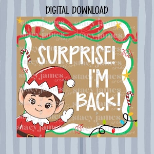 May include: A digital download graphic featuring an elf in a red and white outfit, with the text "SURPRISE! I'M BACK!" The design includes candy canes, stars, and a decorative border with a red bow. The background is a light brown color.