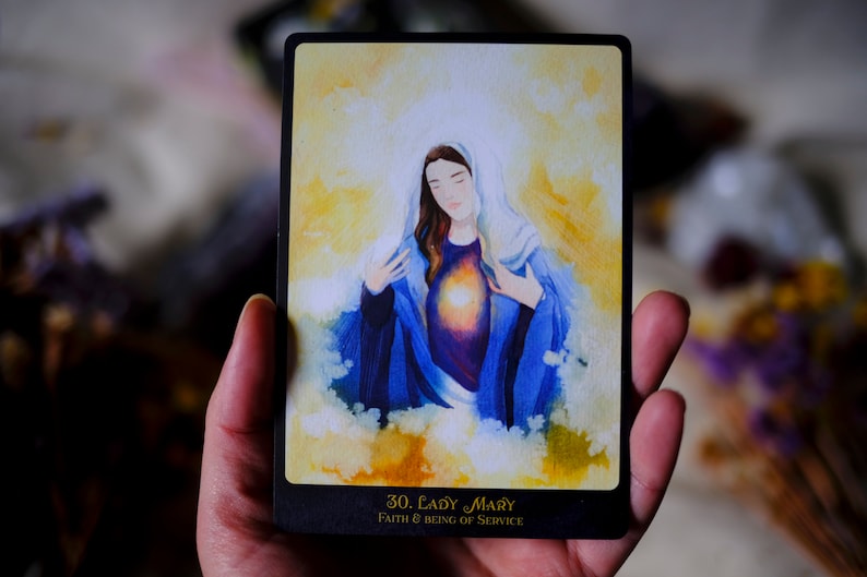 May include: A watercolor illustration of Lady Mary on a card with a black border. The card has the text "30. Lady Mary" and "Faith & Being of Service".