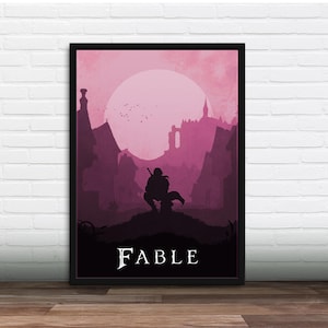 Op de afbeelding: Ingelijste kunstdruk met een silhouet van een figuur met een zwaard, knielend voor een middeleeuwse stad en kasteel, onder een roze zon. Het woord "FABLE" staat in het wit onderaan de print.