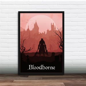 Könnte beinhalten: Gerahmtes Poster mit einer roten Silhouette einer Figur mit Waffen, vor einem Hintergrund aus Burg und Mond. Das Wort "Bloodborne" ist unten in Weiß geschrieben. Das Kunstwerk ist in Schwarz gerahmt.