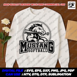 May include: A white sweatshirt with a black and white graphic design of a horse holding a baseball bat. The graphic says "Mustang Softball".