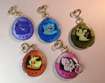 Llavero acrílico de Pokémon Tamagotchi: un adorable llavero de anime | Dije de doble cara de 6,35 cm | Regalo para gamers, fans del anime y coleccionistas