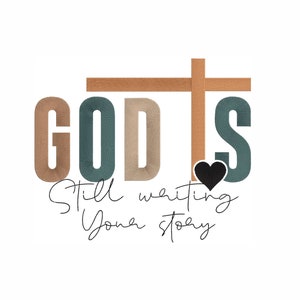 May include: A graphic design with the word "GOD IS" in large, stylized letters with a brown cross above the word. The letters are in shades of brown and teal. A small black heart is below the "S". The text "Still writing your story" is written in cursive below the word "GOD IS".
