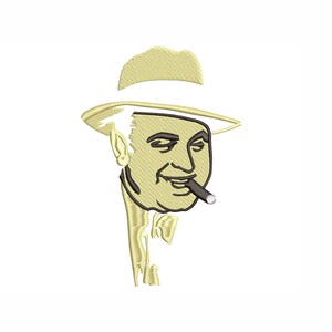 May include: A beige embroidered illustration of a man wearing a hat and smoking a cigar.