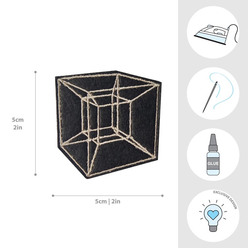 May include: Black embroidered patch featuring a geometric cube design with a gold outline. The patch measures 2 inches by 2 inches and is an exclusive design. Includes icons for ironing, sewing, and glue.