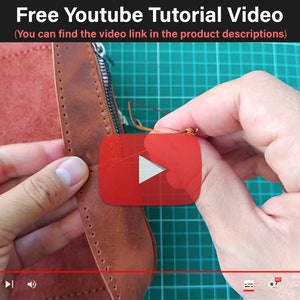 May include: Close-up of a person's hands sewing a brown leather zipper pouch. The leather is stitched with a brown thread. The background is a green cutting mat. The image includes the text "Free Youtube Tutorial Video (You can find the video link in the product descriptions)".