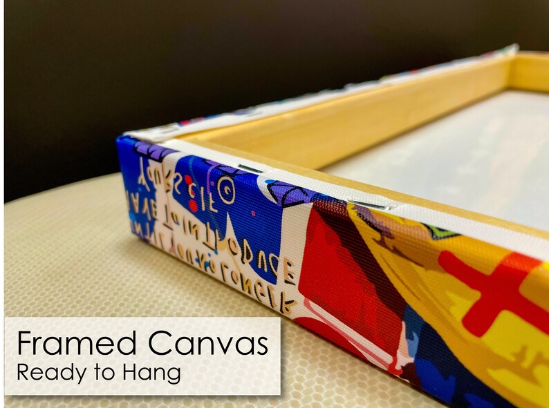 May include: A framed canvas print with a colorful abstract design. The canvas is stretched over a wooden frame and is ready to hang.