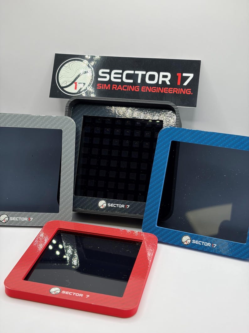 May include: A collection of sim racing engineering displays in various colors: red, blue, gray, and black. Each display has a square screen and a frame with the "Sector 17" logo. The displays are designed for sim racing.