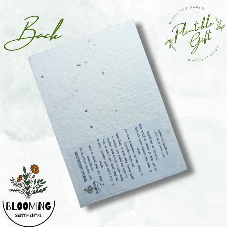 May include: A rectangular, off-white seed paper with visible flecks, featuring the text "Plantable Gift" and "Watch it Grow." The paper includes instructions for planting and the "Blooming Sentimental" logo. The word "Back" is written in cursive.