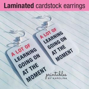 Taylor teacher gift earrings for educational assistant laminated earrings a lot going on at the moment text t-shirt earrings for teacher
