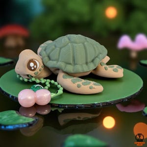 May include: A whimsical turtle figurine with a green shell and tan body, resting on a green lily pad. The turtle has large, expressive eyes and is adorned with a beaded necklace holding pink cherry charms. The figurine is set against a blurred, natural background.