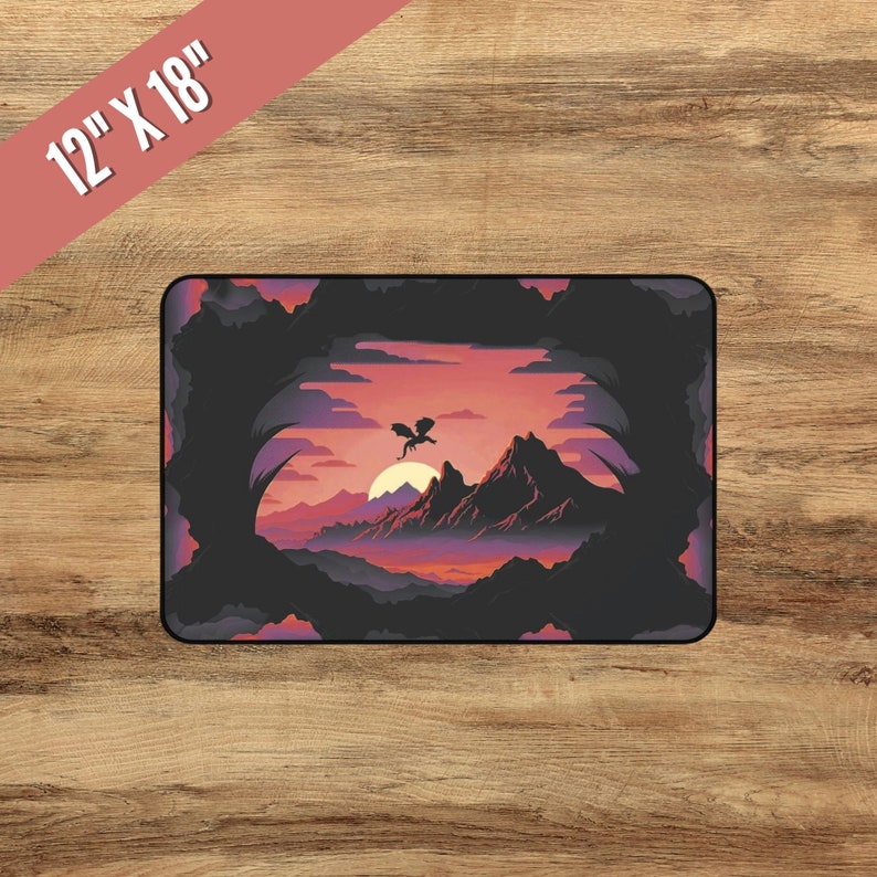 May include: A black silhouette of a dragon flying over a mountain range at sunset. The mountains are purple and pink, and the sky is a vibrant orange and pink. The sun is setting behind the mountains, and the clouds are a dark gray. The image is framed by a dark, shadowy border.