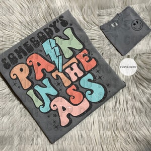 Somebodys pain in the ass Graphic Tees