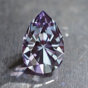 MADE TO ORDER purple to steely blue lab sapphire. Precision cut in a pear design. Synthetic corundum color change stone.