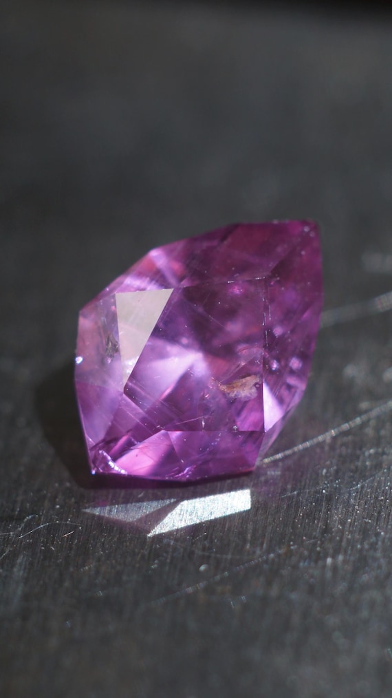 2.36 carat faceted Umba sapphire. Pink purple berry color loose stone. Precision cut in a shield design. 10.3 x 7.2 mm