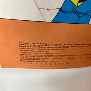 May include: A yellow and orange book cover featuring a cartoon mouse character. The book title is "The Mickey Mouse Make-It Book" and the copyright is 1974 by Walt Disney Productions. The book is part of the "Disney's Wonderful World of Reading" series.