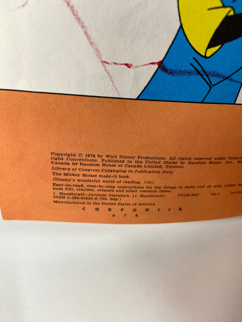 May include: A yellow and orange book cover featuring a cartoon mouse character. The book title is "The Mickey Mouse Make-It Book" and the copyright is 1974 by Walt Disney Productions. The book is part of the "Disney's Wonderful World of Reading" series.