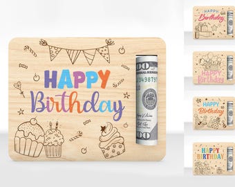 May include: A wooden card with a slot for cash, decorated with colorful birthday greetings, cupcakes, and candy canes. The card reads "Happy Birthday".
