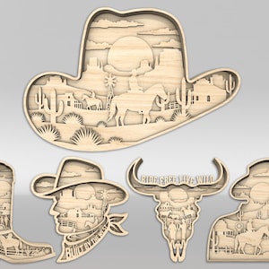 May include: Wooden laser-cut art pieces with a Western theme. The designs include a cowboy hat, a cowboy boot, a bull skull, and two cowboy silhouettes. Each piece features a layered desert landscape with cacti, horses, and windmills. The text "Built by the West" is visible.