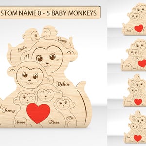 May include: Wooden cutout of a family of monkeys with a red heart in the center. The monkeys are arranged in a pyramid shape with the largest monkey at the top and the smallest monkey at the bottom. The monkeys have names written on them, including Jenny, Junana, Kiana, Alex, Robin, Vinny, and Linda.