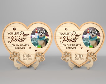 May include: Two wooden heart-shaped photo frames with paw prints and the text "You left paw prints on my hearts forever" and "You left paw prints on our hearts forever". Each frame has a photo of a dog in a pool and the name "George" with the dates "2015-2024".