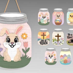 May include: Wooden Easter-themed decorations. A large mason jar-shaped sign with a bunny and flowers, plus smaller jar-shaped ornaments with Easter designs, including bunnies, chicks, eggs, and religious symbols. The decorations are in pastel colors.