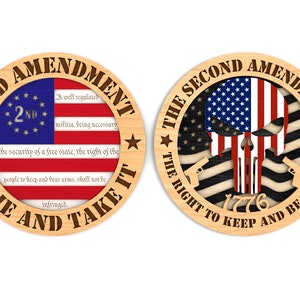 May include: Two wooden round signs with the 2nd Amendment text and an American flag design. The first sign says "2nd Amendment" with the text of the amendment and "Come and Take It". The second sign says "The Second Amendment" with a skull and crossbones design and "The Right to Keep and Bear Arms".