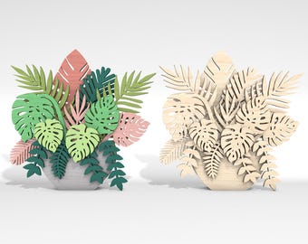 May include: Two decorative plant arrangements made of wood. One is painted in shades of green, pink, and brown. The other is natural wood. Both are shaped like a vase with tropical leaves.