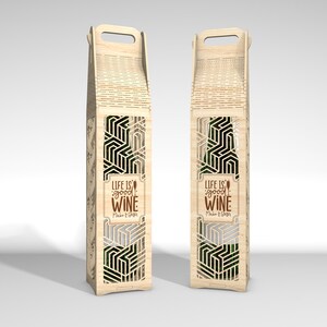 May include: Two wooden wine bottle holders with geometric cutouts and a handle. The holders feature the text "LIFE IS good WINE" in a brown font. The design includes a decorative pattern and a rectangular window to view the bottle.