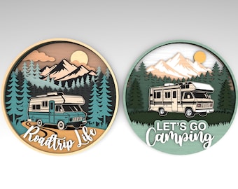 May include: Two round wooden wall art pieces with a camping theme. One features a teal RV with the text "Roadtrip Life." The other has a beige RV and the text "Let's Go Camping."