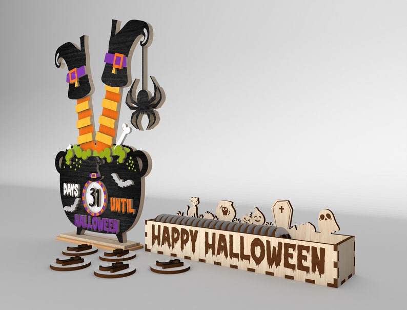 May include: A wooden Halloween countdown calendar with a witch's legs sticking out of a cauldron. The cauldron has a chalkboard with the text "Days Until Halloween" and a number 31. The calendar also includes a wooden box with the text "Happy Halloween" and various Halloween-themed decorations.