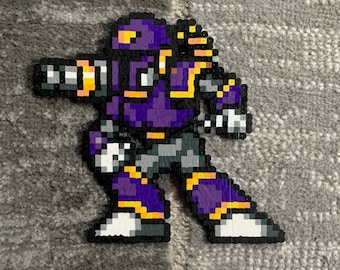 May include: A pixel art character made of colourful beads. The character is a robot with a purple body, yellow accents, and a large gun.