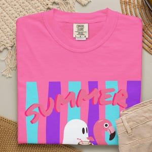 Spooky Summer T-shirt featuring playful ghosts in a fun Summerween-inspired design. Made with soft Comfort Colors fabric, this vintage-style shirt offers a comfortable relaxed fit for Halloween lovers, summer festivals, beach vacations, casual outings, and seasonal gift giving.