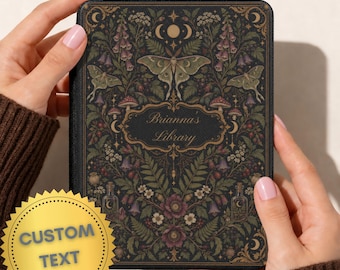 May include: A black e-reader case featuring a botanical illustration with moths, mushrooms, flowers, and small bottles. The center contains a decorative frame with the text Brianna's Library. A gold circular sticker with the text CUSTOM TEXT is attached.