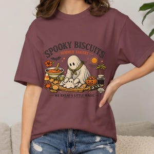 Halloween Comfort Colors tee with a cute ghost kneading dough for a batch of spooky biscuits. This whimsical Summerween shirt blends bakery charm, Halloween humor, and sunny seasonal vibes, making it a fun top for bakers, beach days, pool parties, vacations, and festive gatherings.