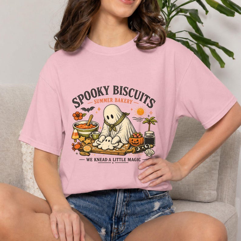 Adorable ghost baker shirt featuring the phrase “Spooky Biscuits” and a playful Summerween bakery theme. This soft heavyweight Comfort Colors Halloween tee is designed for bakers, spooky season fans, ghost lovers, casual celebrations, summer vacations, and unique seasonal gift giving.