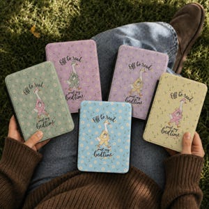 May include: Five rectangular e-reader cases in sage green, lavender, light purple, light blue, and pale yellow. Each case features a floral pattern and a central illustration of a goose wearing pajamas, with the text Off to read past my bedtime.