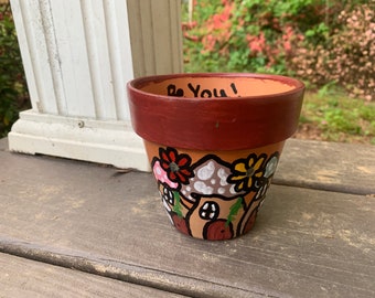 2” painted flower pot, comes with pack of seeds!