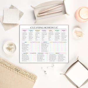 May include: A printable cleaning schedule checklist with a colorful design. The checklist includes daily, weekly, monthly, quarterly, semi-annual, and annual cleaning tasks. The tasks are organized by room and frequency.