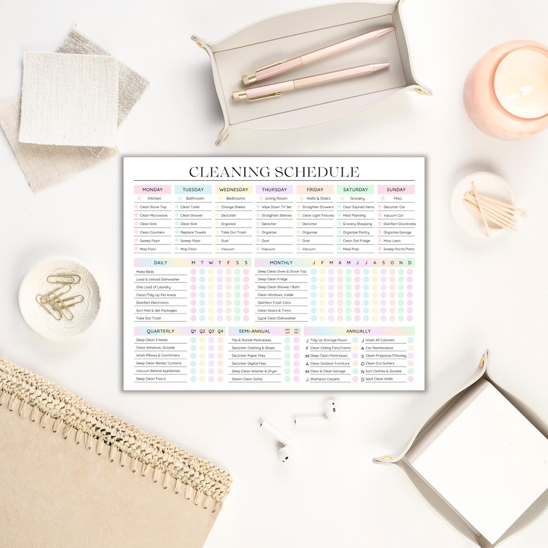 May include: A printable cleaning schedule checklist with a colorful design. The checklist includes daily, weekly, monthly, quarterly, semi-annual, and annual cleaning tasks. The tasks are organized by room and frequency.