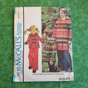 May include: A vintage McCall's sewing pattern for a girls' or boys' unlined coat or jacket. The pattern number is 5259 and the price is $1.15. The pattern shows three children wearing the coat in different colors and styles.