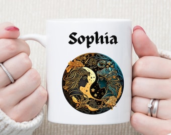 May include: White ceramic mug with a black and gold design featuring two women's faces and the name "Sophia" printed in black.