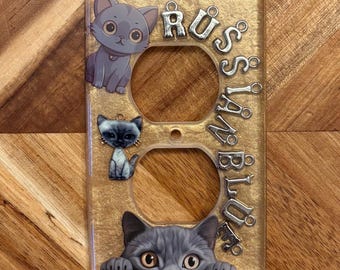 Tapa de enchufe con diseño de gato azul ruso